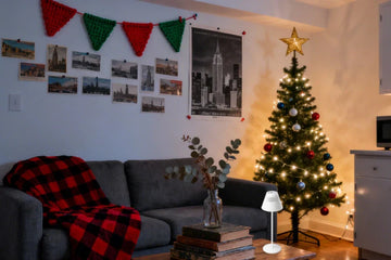 Honeywell M1 wireless lamp providing warm holiday lighting on small apartment desk workspace