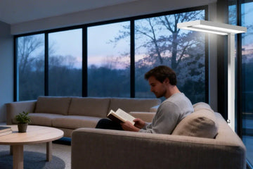Ambient light setup for minimalist living room featuring tall floor lamp with upward and downward illumination