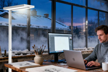 Honeywell 02E floor lamp illuminating book on armchair with optimal 45-degree angle for glare-free reading