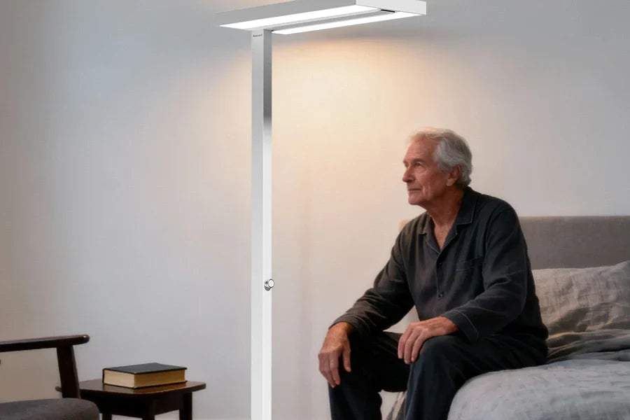 Senior woman reading comfortably with diffused floor lamp eliminating harsh glare on book pages