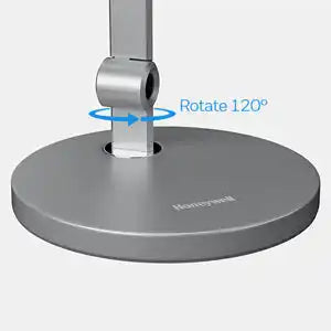 Circular metal monitor stand base with a 120-degree rotation capability.