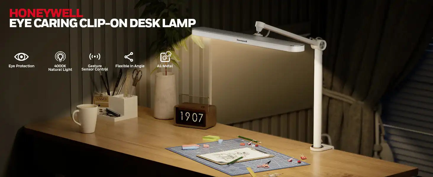 Modern white clip-on desk lamp with adjustable arm.