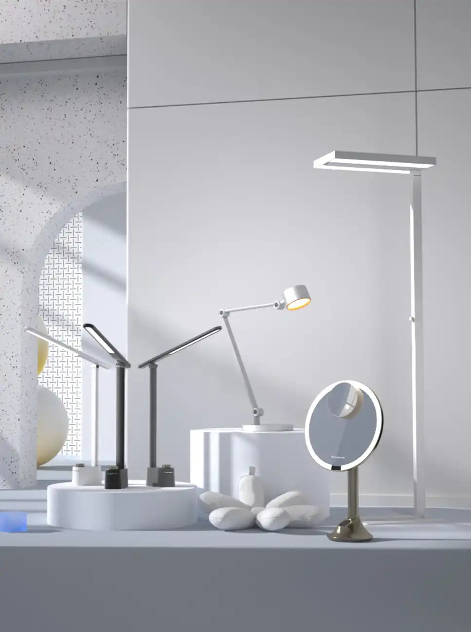 Collection of modern desk lamps and lighting fixtures arranged together.