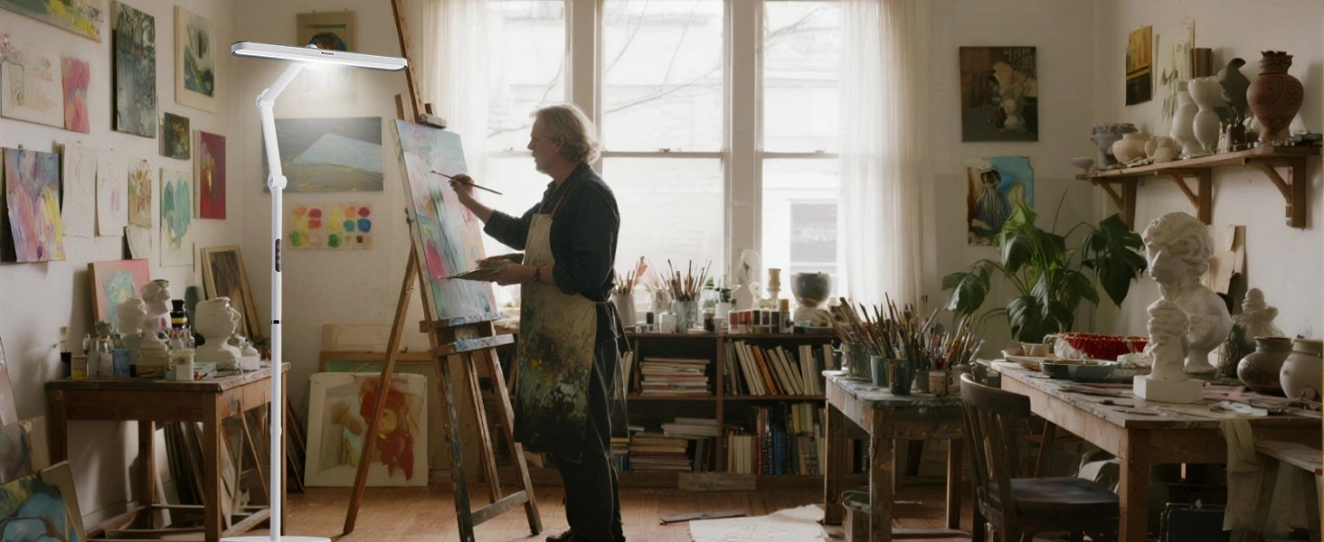 Professional artist studio with adjustable color temperature floor lamp illuminating workspace