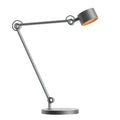 Gray metal honeywell 01a precision spotlight desk lamp with orange interior shade and adjustable articulated arms for office home use