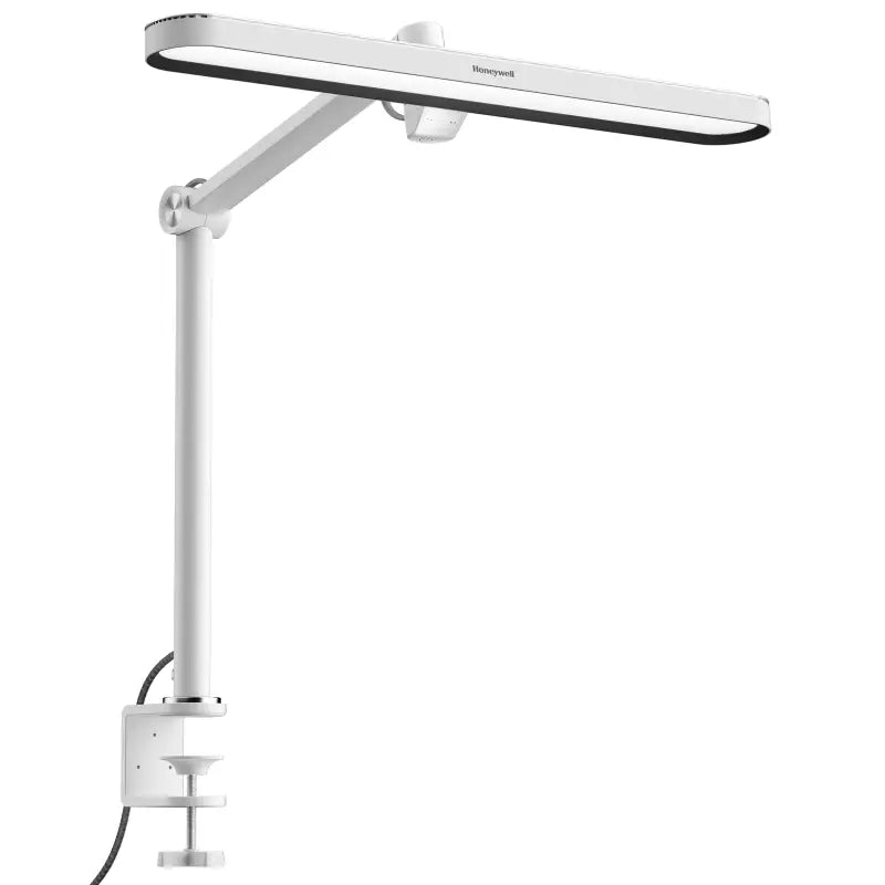 White honeywell 05b02 clip desk lamp with sleek modern design and adjustable arm for artist daylight use