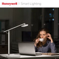 White honeywell h4 intelligent desk lamp with adjustable arm and color temperature control for modern lighting