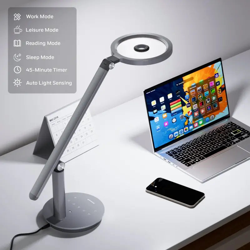 Modern silver honeywell h6 desk lamp with circular led head and adjustable arm for home office use