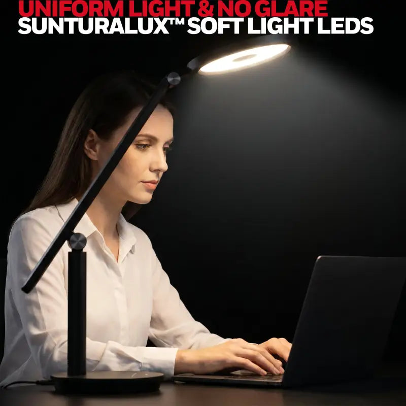 Black honeywell h6 desk lamp with adjustable arm and circular led head emitting soft uniform light for home office
