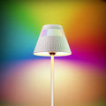 White pleated lampshade with vertical ridges on a slender white pole cordless table lamp and night light by Honeywell M1 rgb