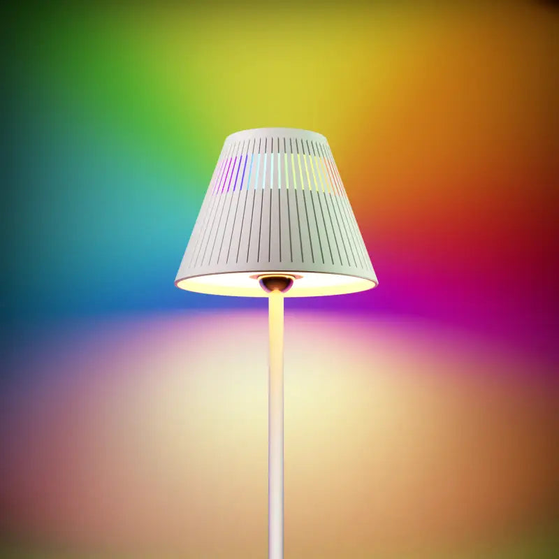 White pleated lampshade with vertical ridges on a slender white pole cordless table lamp and night light by Honeywell M1 rgb