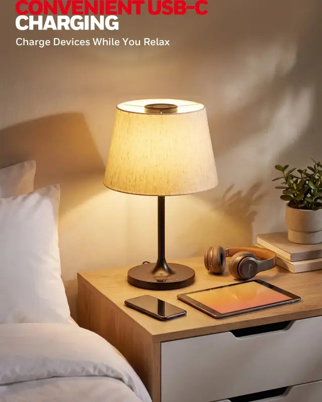 Honeywell HWT-M2 table lamp with warm-toned fabric shade and black metal base featuring a USB-C charging port