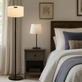 Tall black floor lamp with cylindrical off-white fabric shade featuring honeywell hwt-m2 table lamp charging port