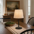 Honeywell hwt-m2 table lamp with warm-toned linen shade and black metal base featuring a built-in charging port