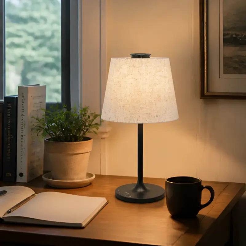 Honeywell hwt-m2 table lamp with warm-toned textured off-white fabric shade and sleek black metal base with charging port