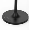 Black circular base of honeywell hwt-m2 table lamp with charging port and subtle control buttons in sleek minimalist design