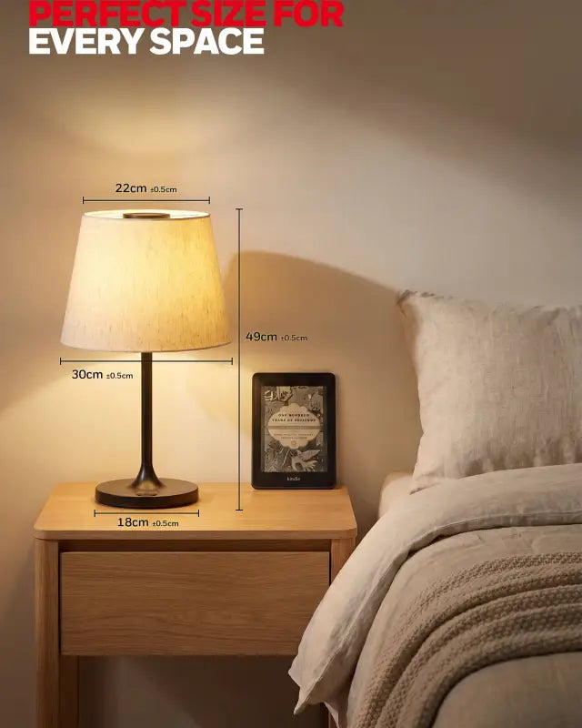 Honeywell hwt-m2 table lamp with warm-toned fabric lampshade and dark metal base featuring charging port