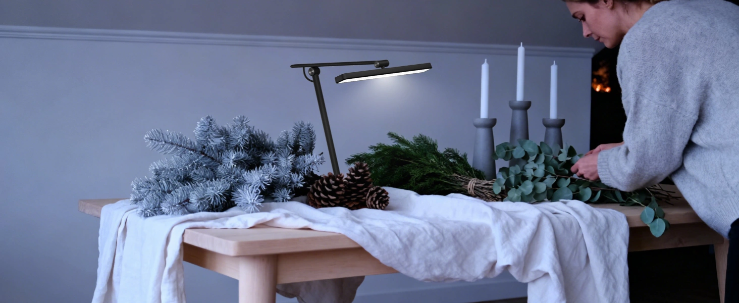 Nordic-inspired minimalist Christmas lighting setup with white candles and natural elements