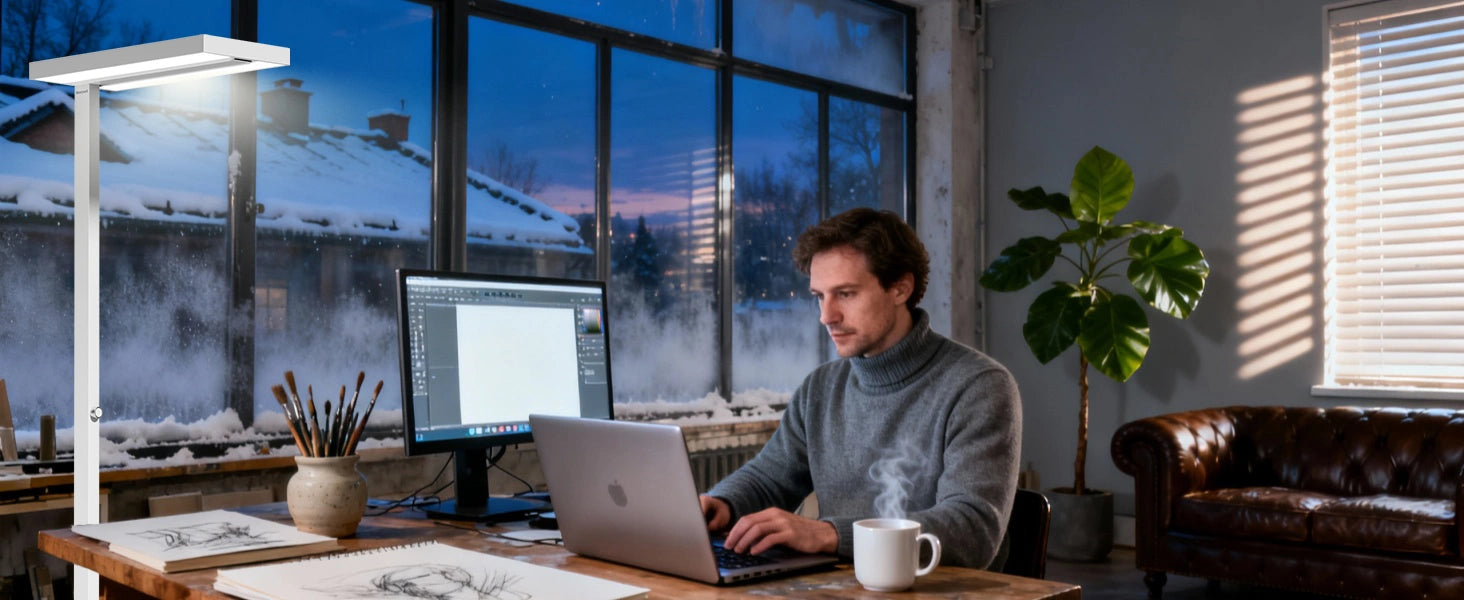 Remote work desk setup with floor lamp positioned behind monitor to eliminate screen glare during winter
